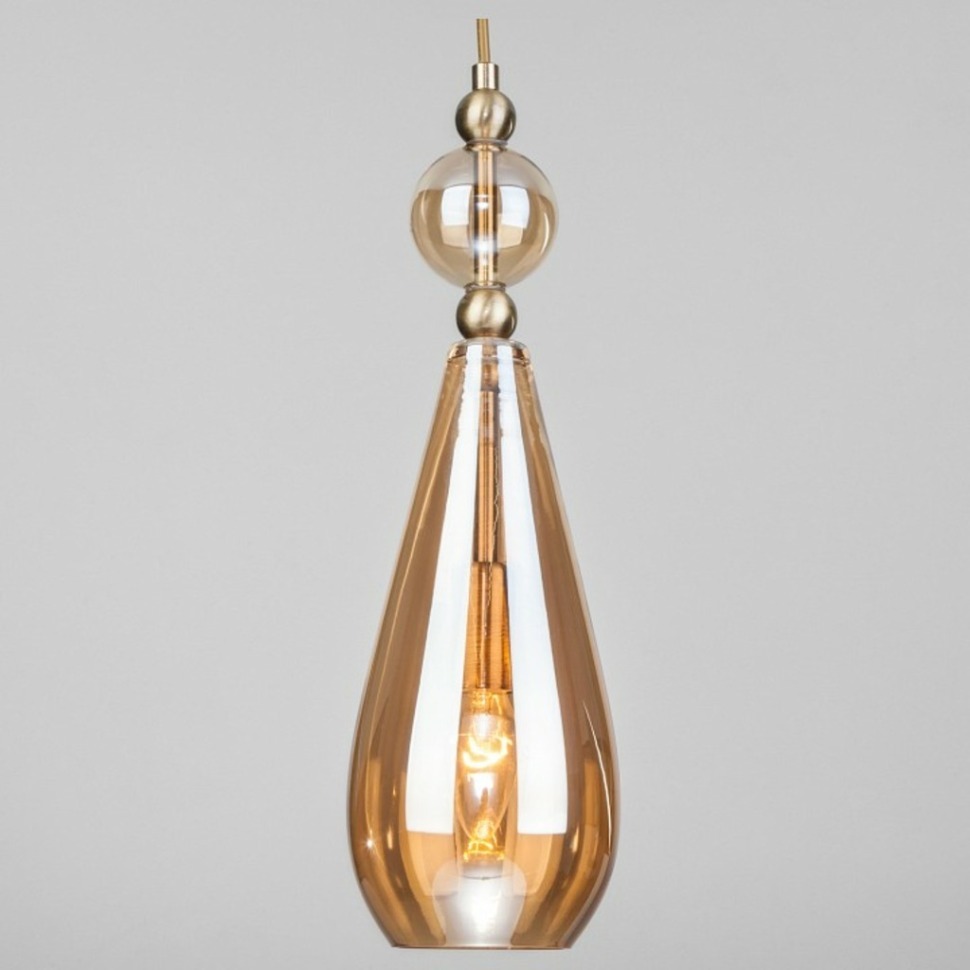 Фото Подвесной светильник Eurosvet Ilario 50202/1 янтарный EV_a051706 - интернет-магазин МегаТерем в Москве